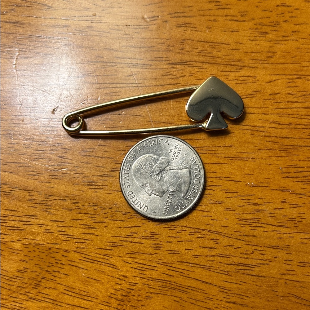 Elegant Gold Safety Pin Brooch with Spade Accent